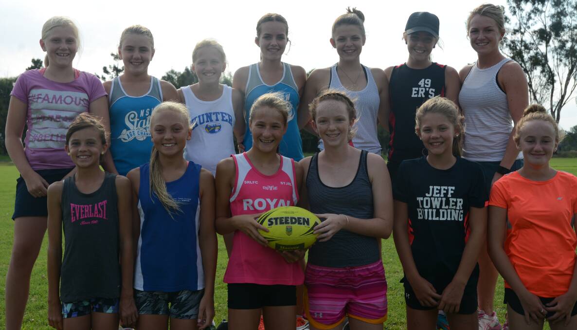 EXCITED: The 14 girls side with coach Sofie Casson at training on Tuesday ahead of the Junior State Cup, which starts on Friday.