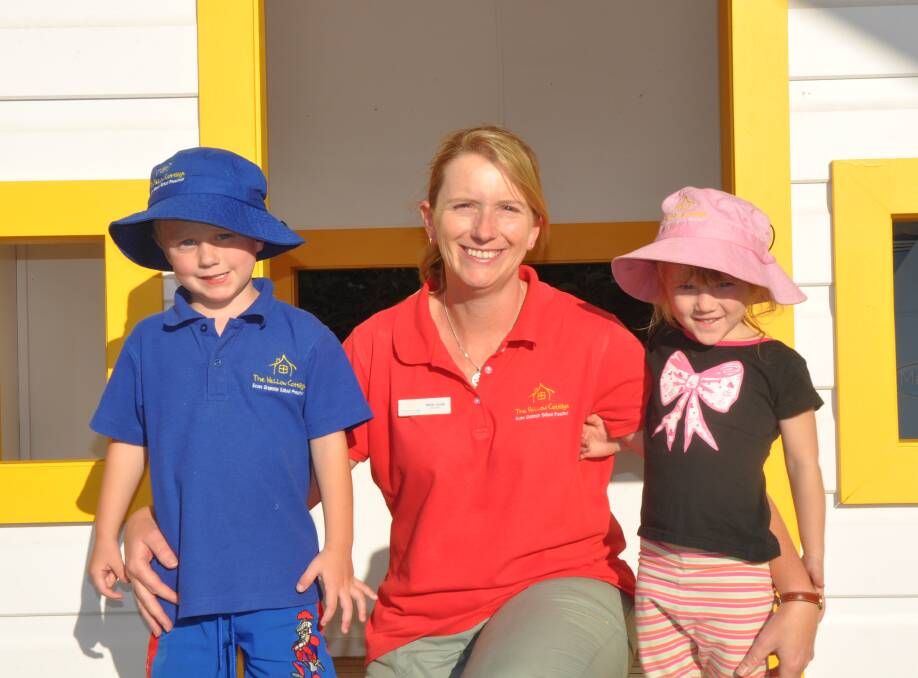 LIVING THE DREAM: Nikki Cook with Kayden Neate and Chloe Clydsdale at The Yellow Cottage this week.