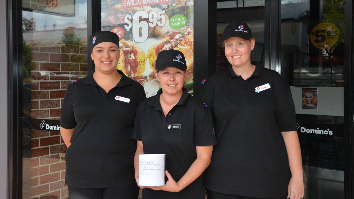 DOING THEIR BIT: Domino's Pizza employees Jocelyn Lingner, Shantelle Green and Alicia Corbett with a donation tin in Scone.