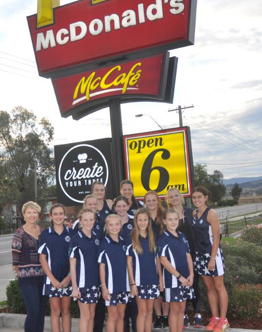 HARD AT WORK: Scone netballers have been raising money ahead of their trip to the State Age Championships. Another fundraiser will be held at McDonald's on Monday night.