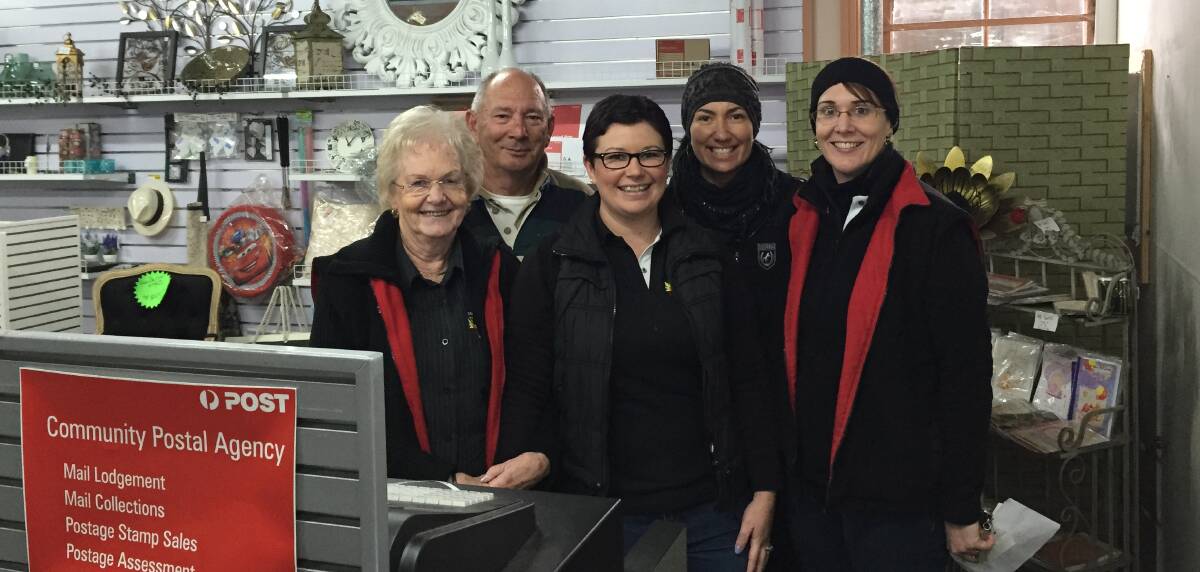 OPTION: Maureen and Paul Bowd with Bek Whyte, Toni Fremantle, and Naomi Hutchison at the Community Postal Agency inside Dooley's Store.