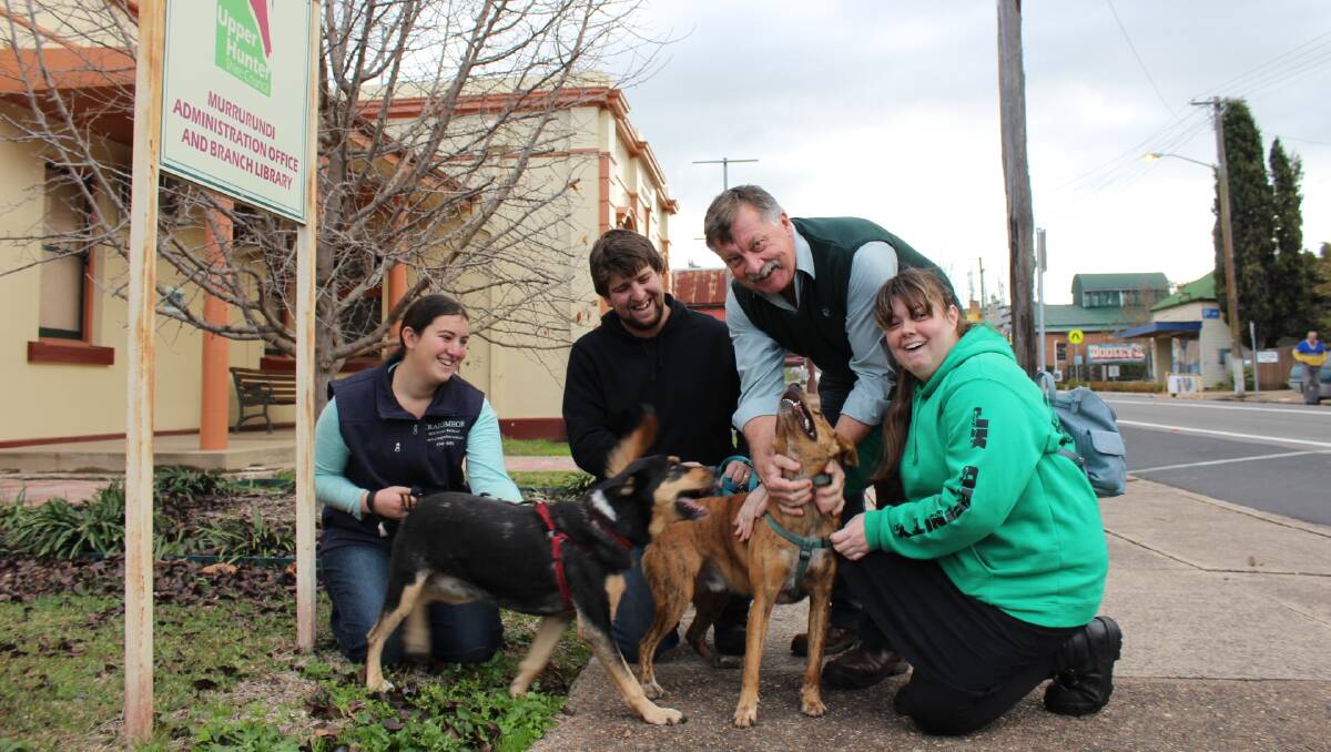 TAKE A WALK ON THE RESPONSIBLE SIDE: Council Compliance Officer David Shields with pet owners Rebecca, Andrew, and Joanna Aboozaid, who regularly walk their much loved dogs around Murrurundi.