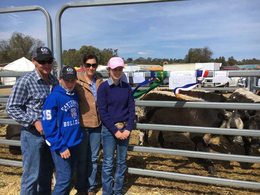 Jason and Tammy Nairne and their children Jack and Sarah with their winning pen of Speckle Park steers at the Merriwa Show Prime Stock competition.