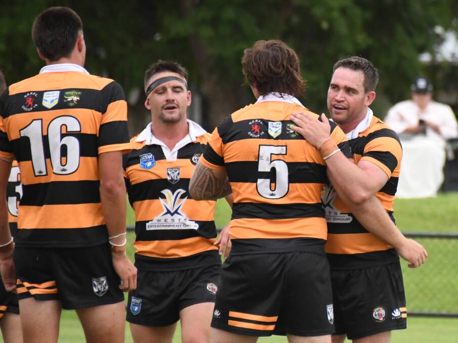 The Tigers celebrate against the Rams at Narromine this month. File picture by Nick Guthrie