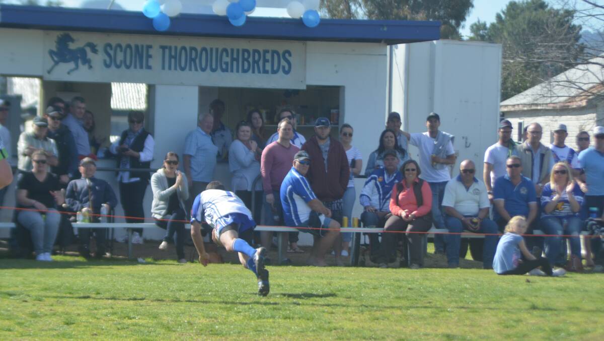 TRY TIME: Scone's Kyle Wilcher dives over for a consolation four-pointer in the Group 21 reserve grade final at Scone Park on Sunday.