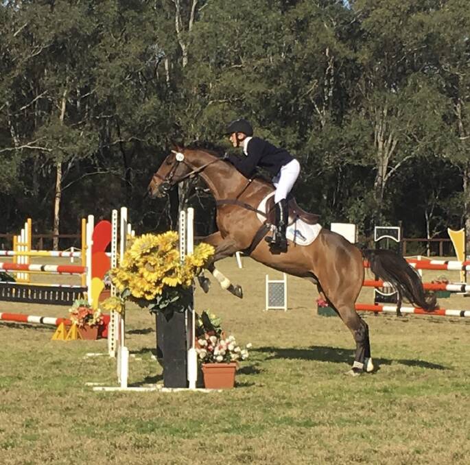 PRIMARY CHAMPION: Charlie riding his horse Maximus at the NSW Interschools Championships in Sydney.
