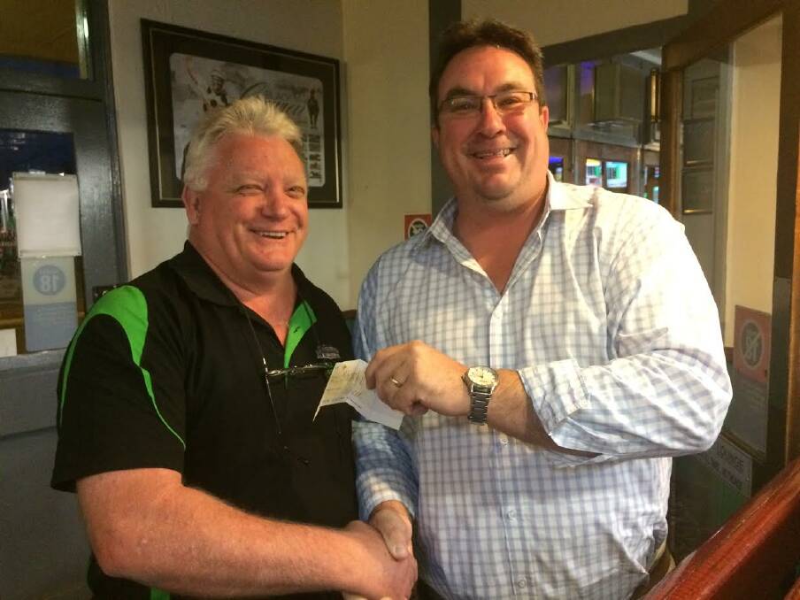 COMMUNITY SUPPORT: Ian Campbell presenting Scone Junior Rugby League Jamie Munn with the donation for $2090 raised from the charity event at the Royal Hotel in Scone.