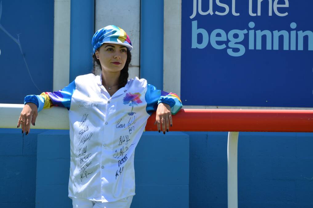 Scone Race Club's Anaïs Bouvier wearing the signed silks.