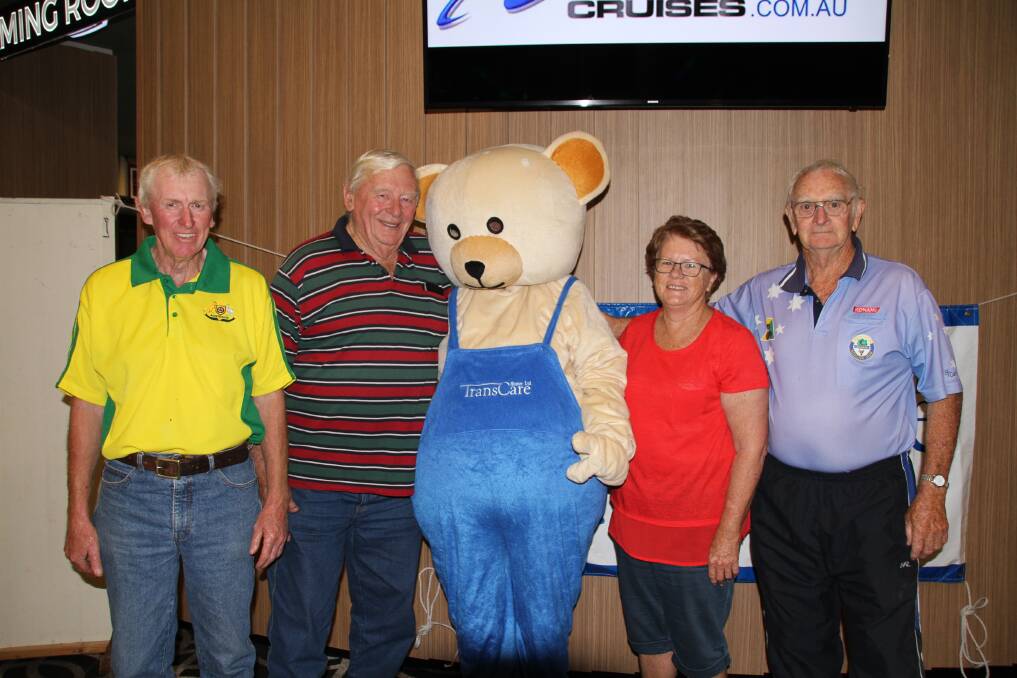 TOP TEAM: Members of the winning team 'The Hot Shots', Daryl Everleigh, Michael Smith, Cath Coady and John Day pictured with Benny the Bear.