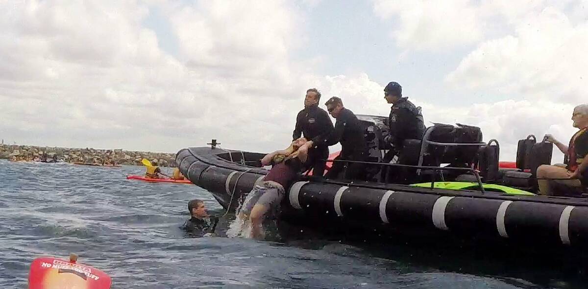 ACTION STATIONS: Water police remove a protester from Newcastle Harbour after last year's event disrupted shipping movements. 
