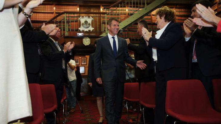 NSW Premier Mike Baird is congratulated after newly elected MPs were introduced.  Photo: Kate Geraghty