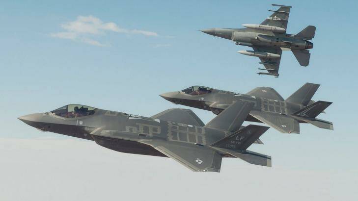 A Royal Australian Air Force F-35A flies in formation with a US Air Force F-35 and F-16 during trial flights from Luke Air Force Base in Arizona. Photo: Matthew Short