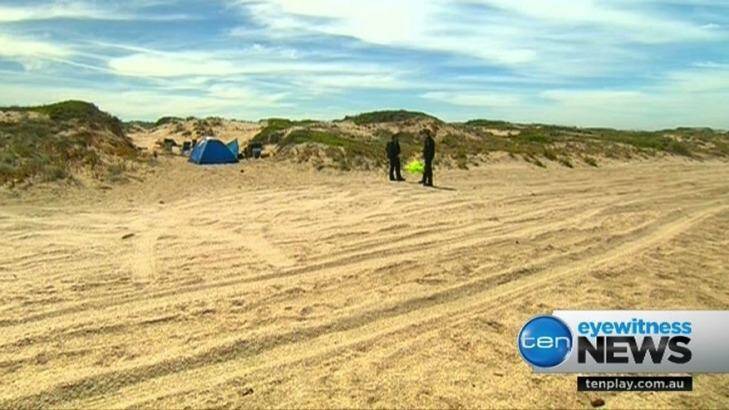Police at the beach near where the alleged abduction took place.  Photo: Ten News