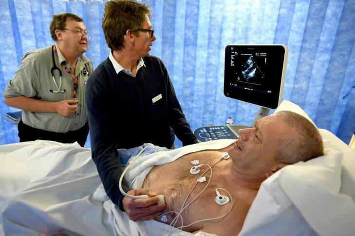 Dr Matt Davis and Dr Bruce Way wth emergency patient David McLean who has had an ultrasound performed as part of diagnosis of his condition and what treatment should be given on the basis of his heart.
31st May 2017.
Photo: Steven Siewert