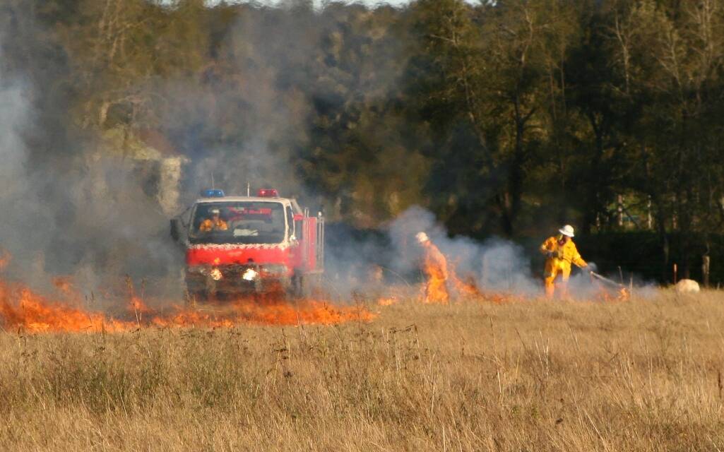 FIRE RISK: File shot of RFS crews tackling a grassfire.