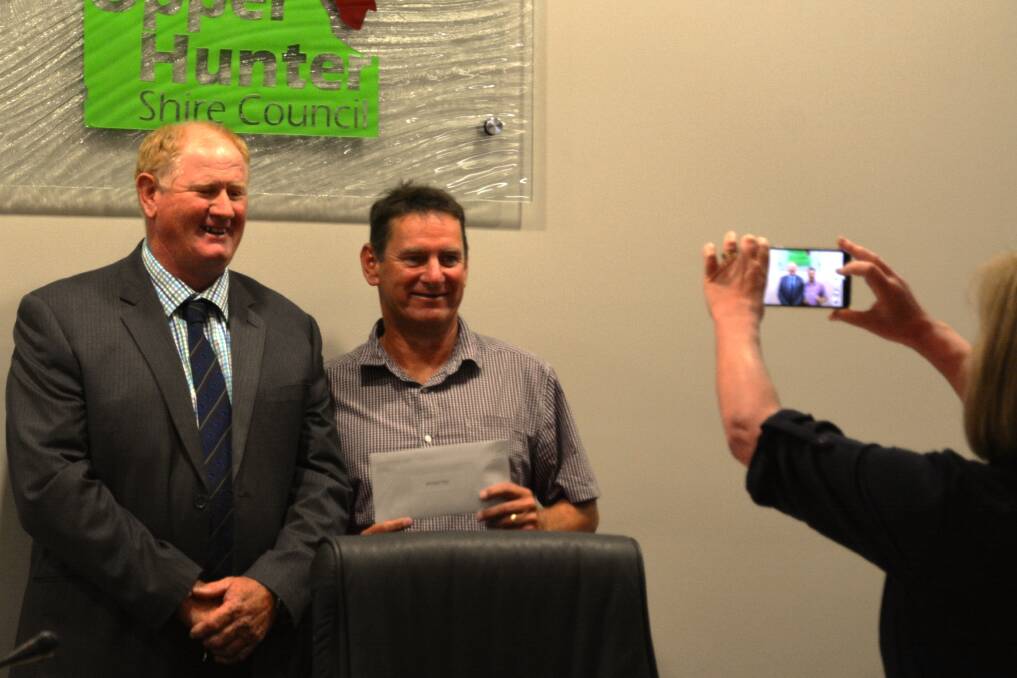 BIG INNINGS: Upper Hunter Shire Deputy Mayor Cr Maurice Collison (left) acknowledged Mick Day's 20 years of service at a presentation during Monday's ordinary general meeting.