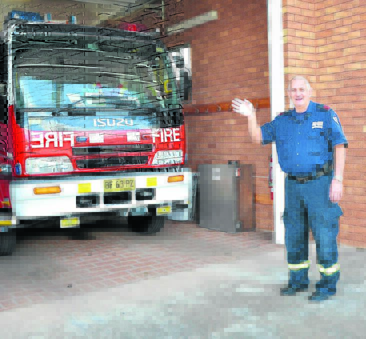 Scone’s John Tilse reluctantly waves goodbye to the Scone Fire and Rescue Station as he hung up his helmet for the last time yesterday.