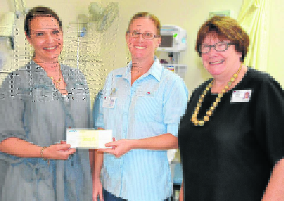 Cocktails by Pink Candlelight organiser Liza White presents a donation of $10,000 to Muswellbrook District Health Service Chemotherapy Unit team leader and cancer care coordinator Tracey Leatherday and health service manager Wendy Hordern.