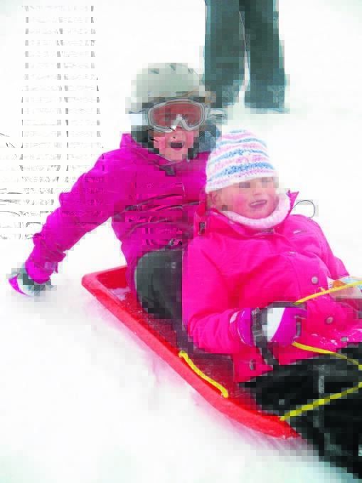 Scone Scouts Ceclia Cooper and Lulu Davis on the toboggan slopes at Perisher over the holidays. 