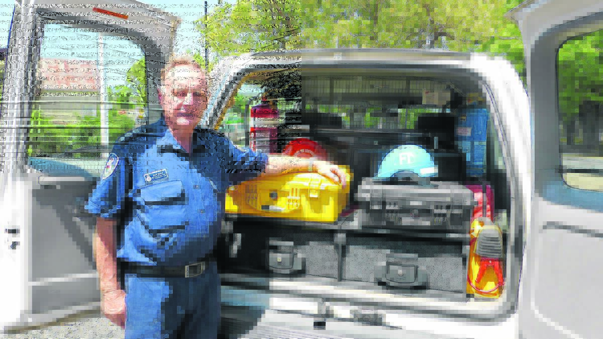 Rural Fire Service volunteer authorised fire investigator Noel Scales with the new drawers for his vehicle.