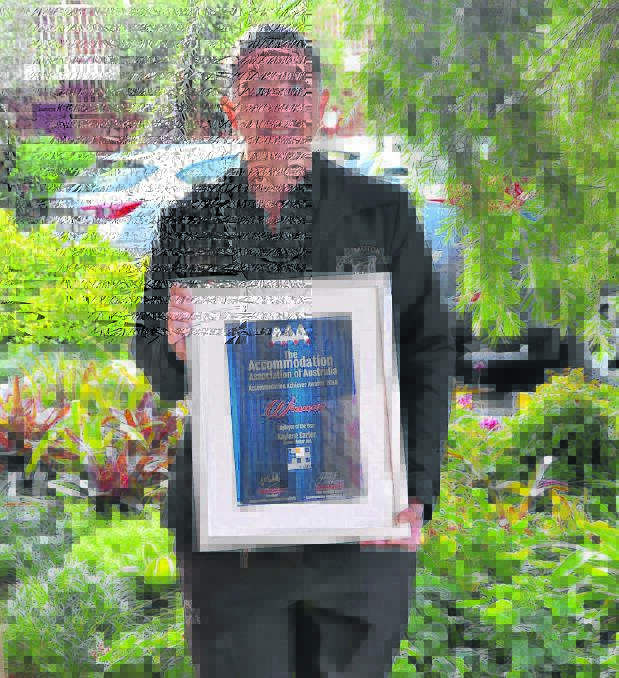 Scone Motor Inn employee Kay Carter with her certificate for Accommodation Association of Australia Employee of the Year. 