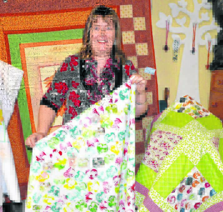 Local Upper Hunter woman Elizabeth Birch with some of the quilts and fabric work she has proudly created and will showcase this weekend at the Anglican Parish of Muswellbrook’s Spring Fair.