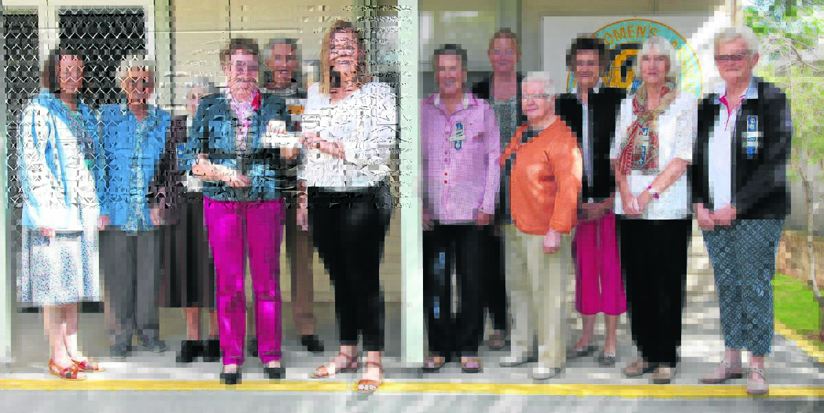 Scone and District CWA members Carol Downton, Muriel Halsted, Lorna Muffett, president Anne McPhee, Wendy Balneaves, Claire Prentice, Deslt Alseben, Margaret Newman, Margaret Lawrence, Sue Lewis and Carolyn Carter presenting Ainsleigh Crisp (centre) with her cheque.