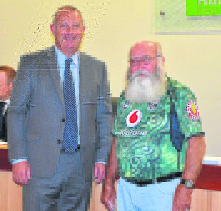 Upper Hunter Shire mayor Michael Johnsen congratulates retiring worker Alistair ‘Mick’ McBain on his dedicated career. 