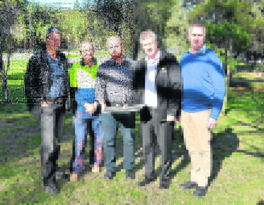 New South Wales Crown Holiday Parks Trust planning and design coordinator Nev Green, Lake Glenbawn park manager Brenton Merchant, park coordinator Brad Collins, chief executive officer Steve Edmonds and NSW Trade and Investment representative Derek Scott looking over the plans at Lake Glenbawn on Tuesday.