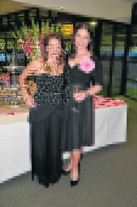 Guest speaker and cancer survivor Lisa Poulos with close friend Liza White at the event on Friday.