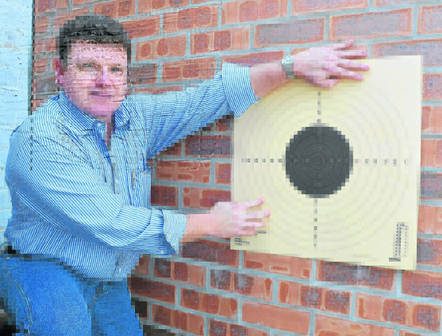 Scone Pistol Club Inc secretary Daniel Hickson with one of the targets members of the club would be familiar with. 