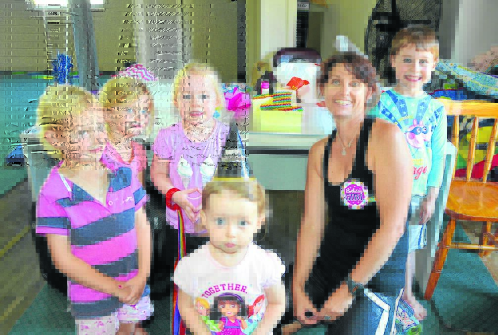 Scone youngsters Eliza Darling, Emily Sawyer, Samantha Hyland, Kinder Gym leader Lisa McGrath, Ben Hyland and (front) Olivia Kennedy with the first birthday cake ready to be enjoyed.