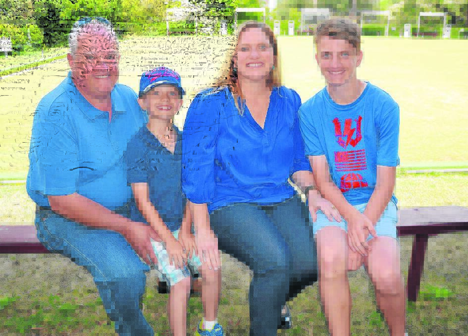 Prostate cancer survivor Will Wallace with his two sons Braeden and Liam and wife Danette (second from right).