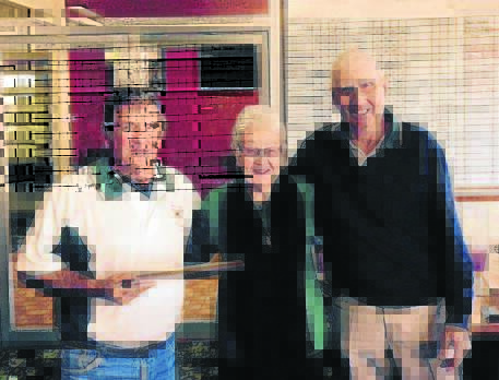 Pam Behringer presenting the 2015 Par 3 Champion trophy to Jock O’Connor with President George Smith looking on.