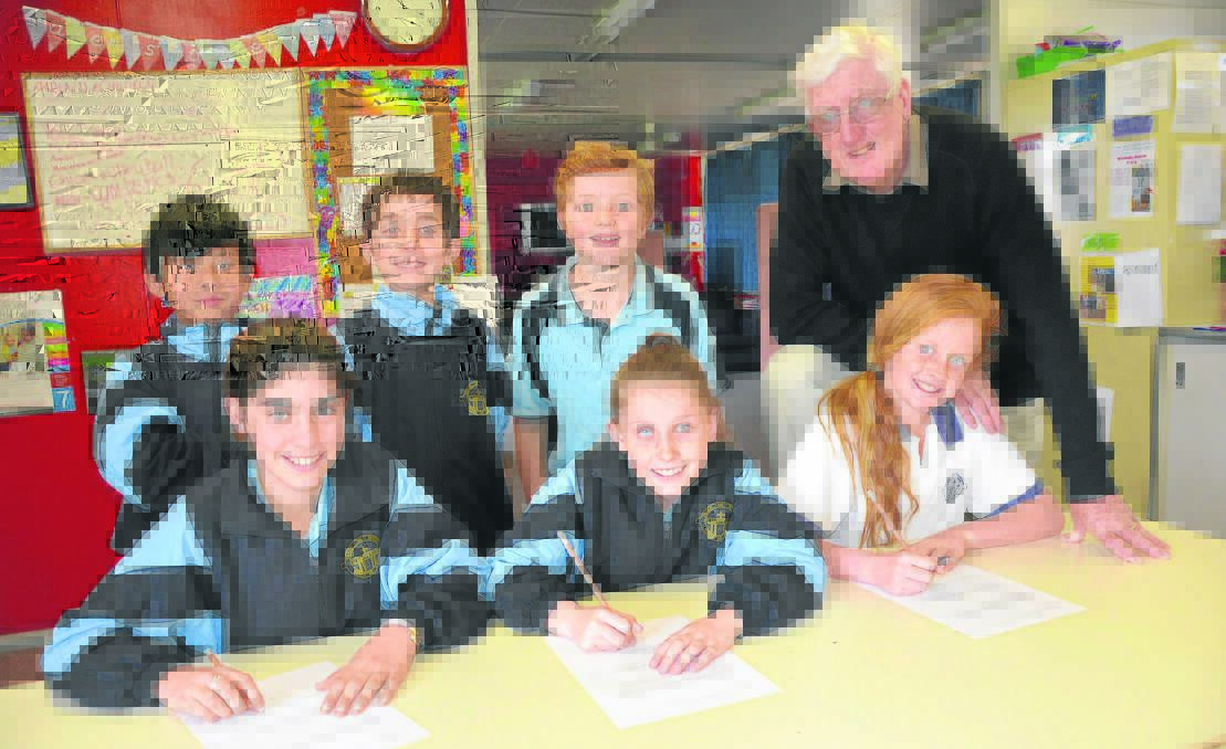 St Mary’s Primary School mathematics Olympiad representatives (back) year 5 students Anthony Wong, Isaac Petherbridge, year 6 student Thomas Hobbs, volunteer teacher Phil McGuirk, (front) year 6 students Shannon Dockerty, Paige Backhouse and year 5 student Eleanor Kembrey.