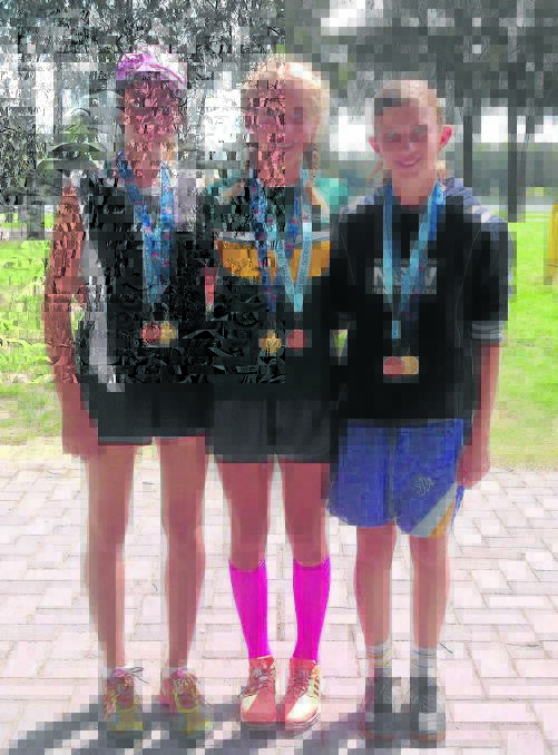 The junior girls relay team of Hannah Gleeson, Chloe Hollingsworth and Caitlyn Whitehead  who won gold in the Combined Catholic Colleges Triathlon Relay Championship and bronze in the NSW All Schools Championship last week.