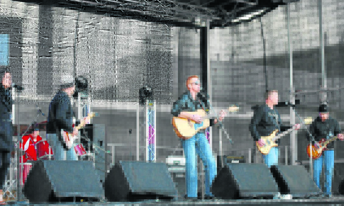 Darryl Bowen and his fellow Aberdeen band members on the live stage supporting Alex McKinnon at the ‘Rise For Alex’ day at Hunter Stadium last Sunday.