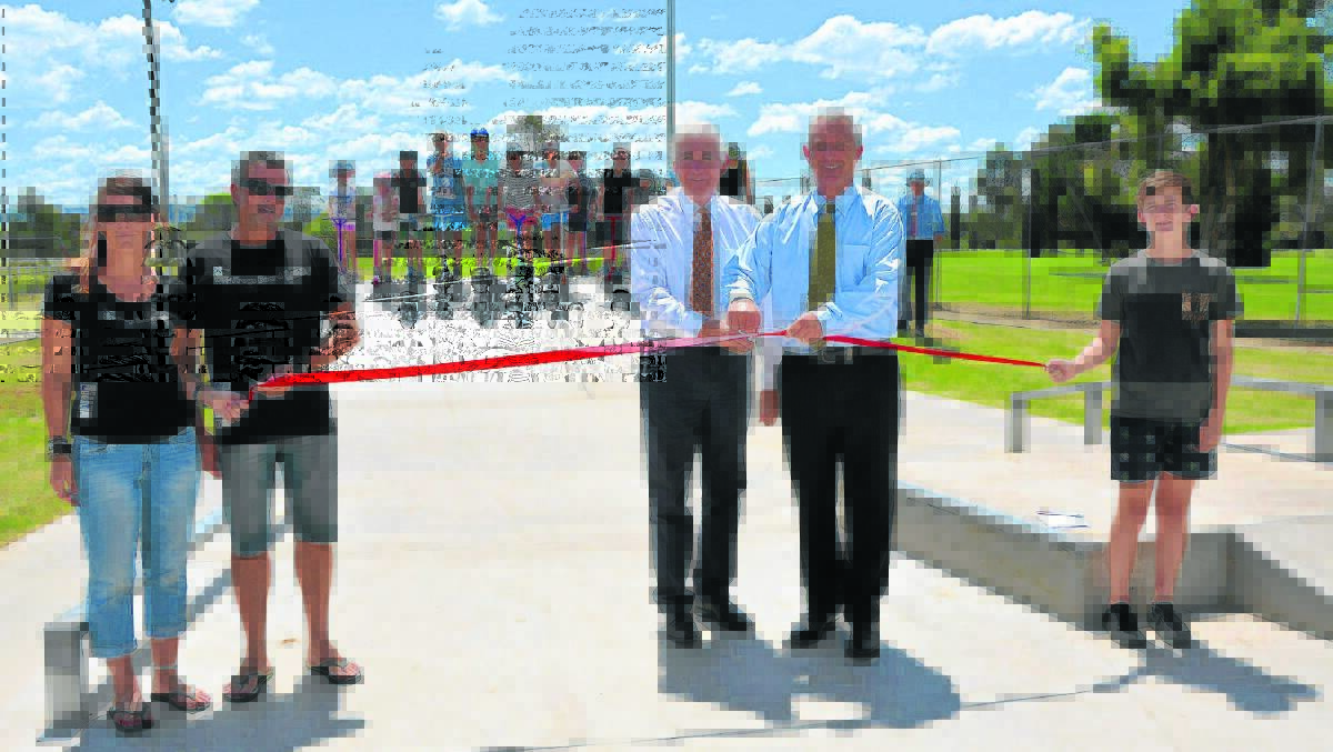 Several Deen City Youth Group members attended the special official  opening of the Deen City Skate Park last Thursday. They are pictured watching on as Member for Upper Hunter George Souris and Upper Hunter Shire mayor Michael Johnsen formally cut the ribbon, helped by Janita Huizer and Jeremy Fisher from wiK’ed Frogs Board Room and Deen City Youth Group member Edan Tickle.