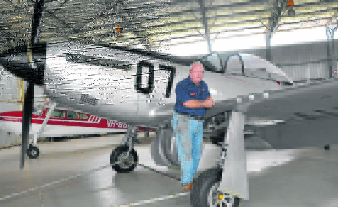 Scone RSL Sub-branch president Val Quinell with the P51 Mustang which will feature at the Black Tie Dinner to commemorate the Centenary of Anzac.