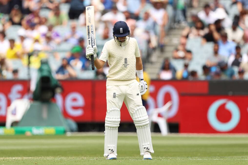 CHASING: Joe Root raises his bat after scoring a half century during day one of the third Test match in the Ashes series at the MCG. Picture: Getty