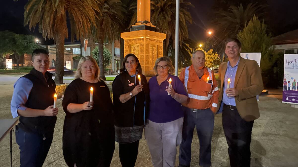 VIGIL: (L-R) Lyndall Gunning, Councillor De-anne Douglas, Marina Lee-Warner, Una Garland, Councillor Darryl Marshall and Upper Hunter MP Dave Layzell at a candlelight vigil for domestic violence awareness in Muswellbrook on Wednesday, May 4 2022. Picture: Mathew Perry