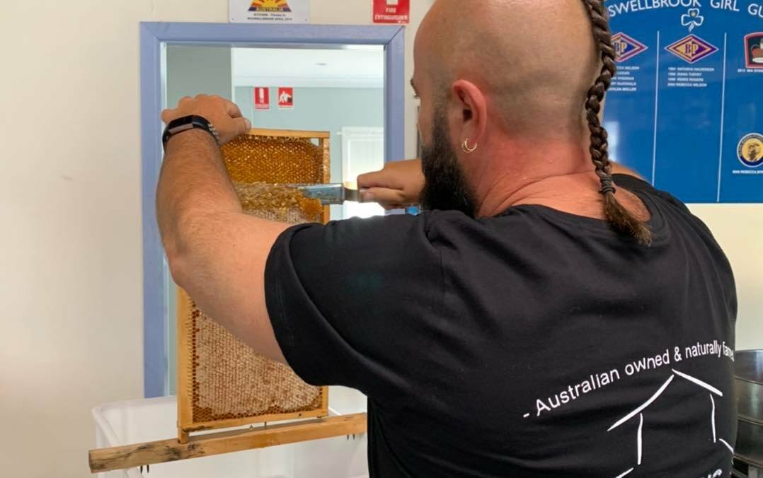 EXTRACTION: Upper Hunter beekeeper Brett Ruxton during a honey extraction demonstration in Muswellbrook in February 2022. Picture: Supplied