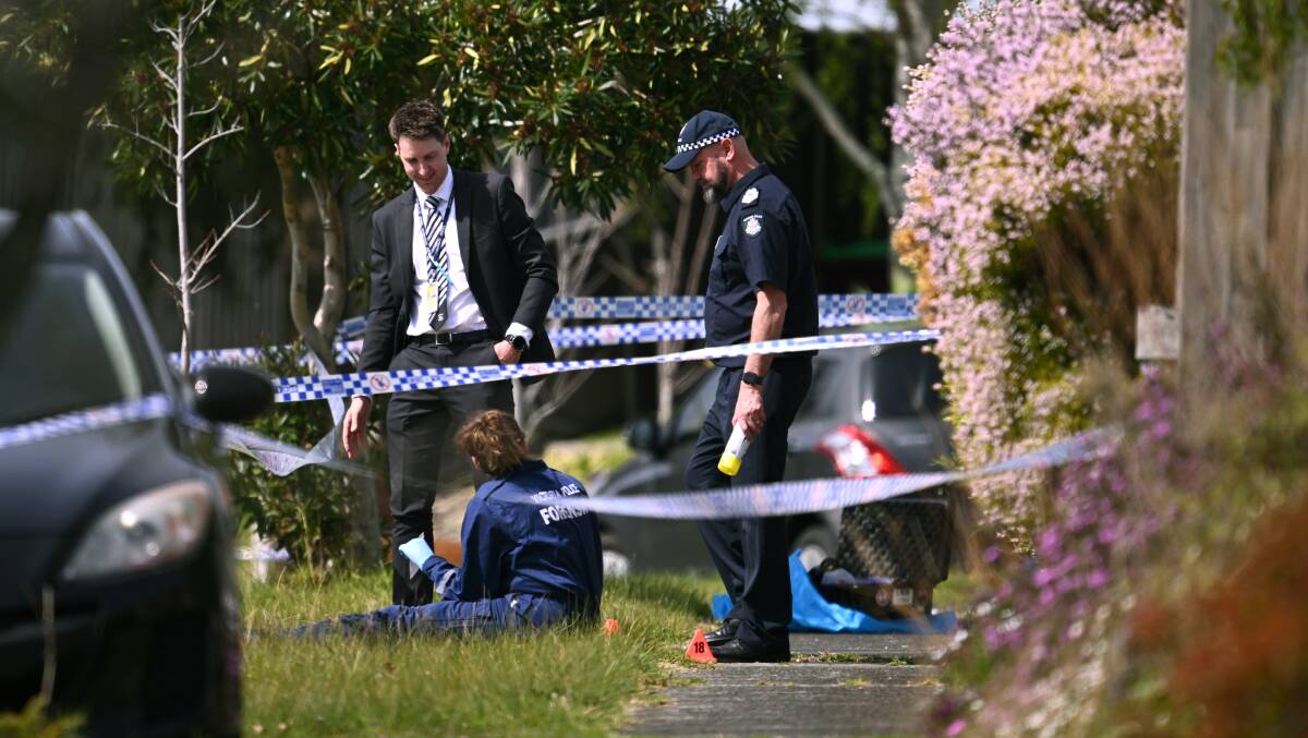 Victoria Police in the Melbourne suburb of Endeavour Hills where a sleeping teenager was injured after shots were fired at his home. Picture AAP Image/Joel Carrett