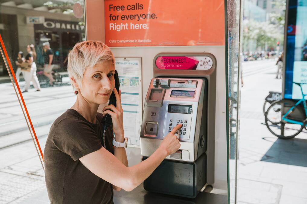 Anastasia Woolmer at a payphone. Picture supplied