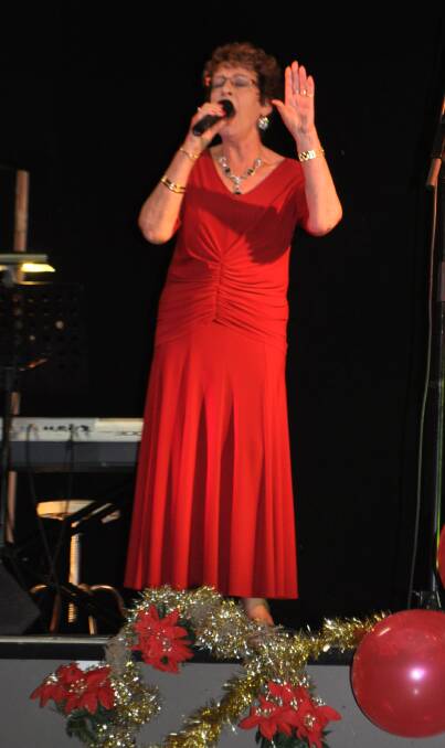 WELL-KNOWN: Margaret Albury performing at a Christmas concert in Cessnock in 2011.