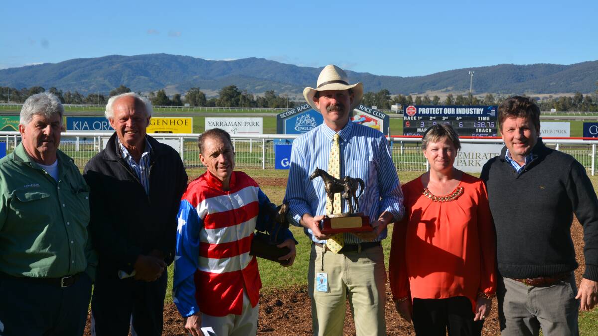 WINNERS: Greg Ryan and Greg Bennett were presented with their trophies at Scone Race Club on Monday.