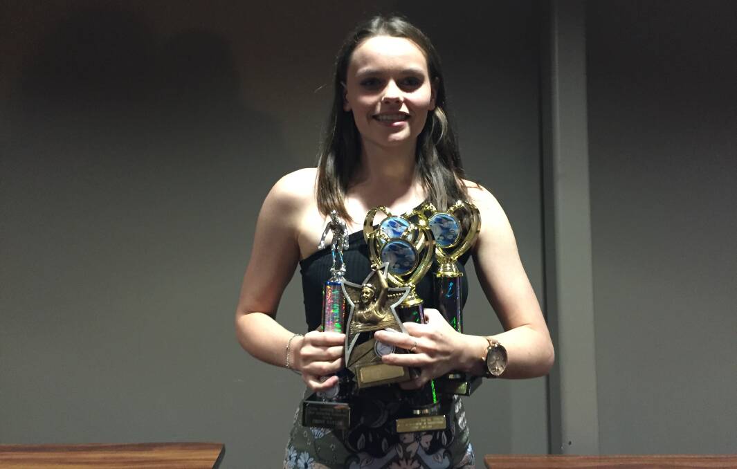 IMPRESSIVE HAUL: Ebony Taylor with her awards from the Scone Swimming Club's presentation night.