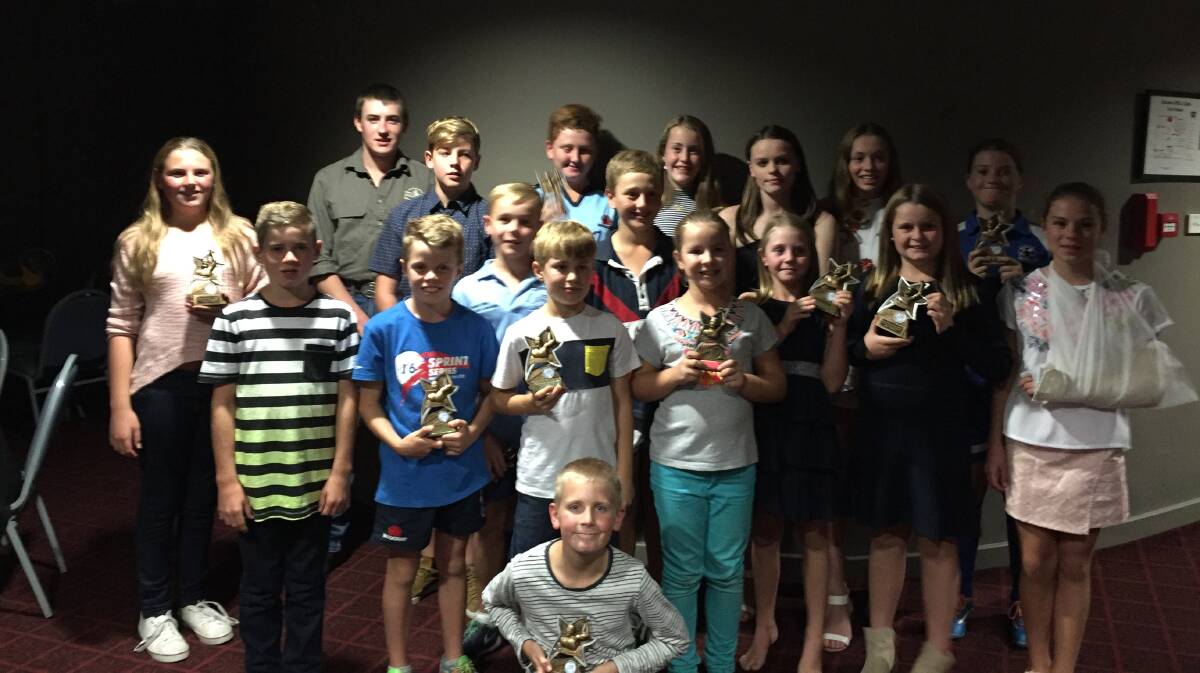 WINNERS ARE GRINNERS: Age Champions for the season with their trophies.