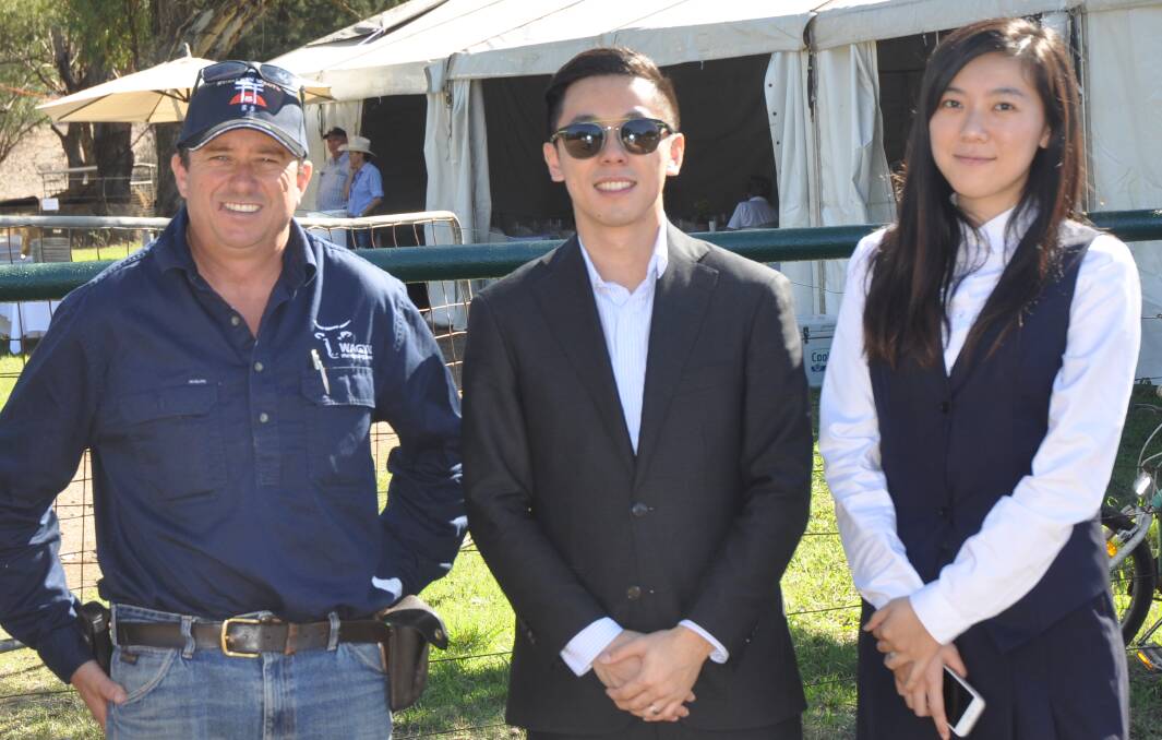 INVESTMENT: Peter Bishop with AAAW general manager Michael Wang and Jenny Wang at the Kuro Kin Wagyu property near Bunnan on Thursday.