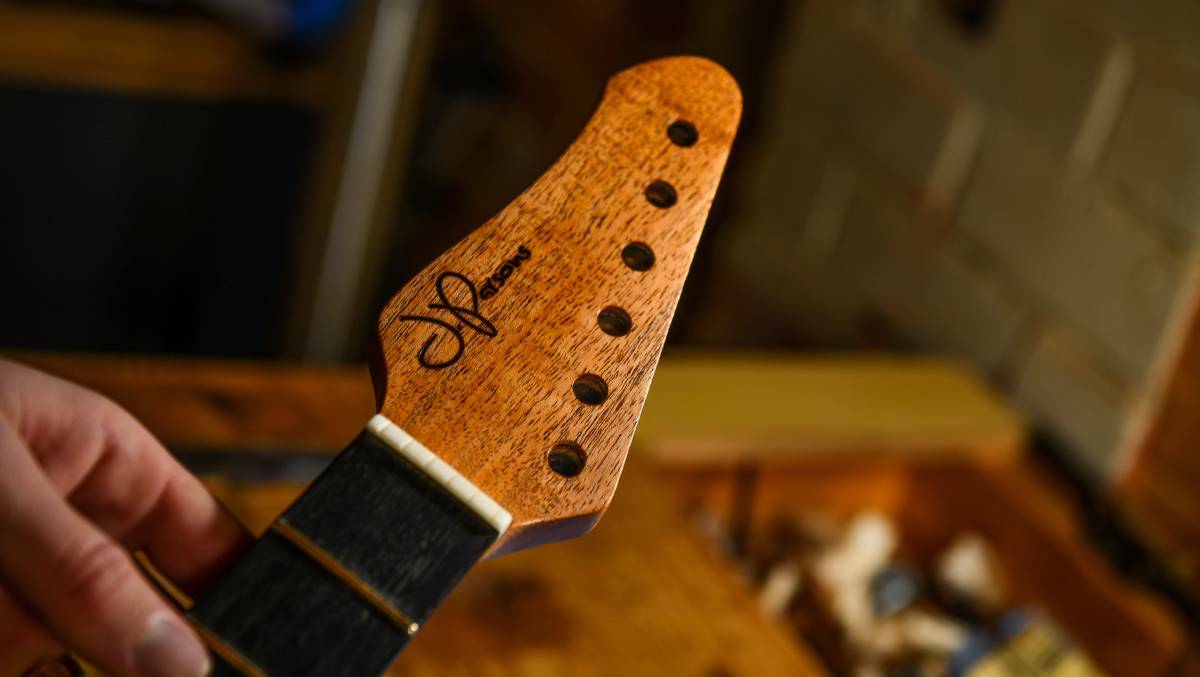 Refined: The headstock with J.Parsons Guitars logo. 